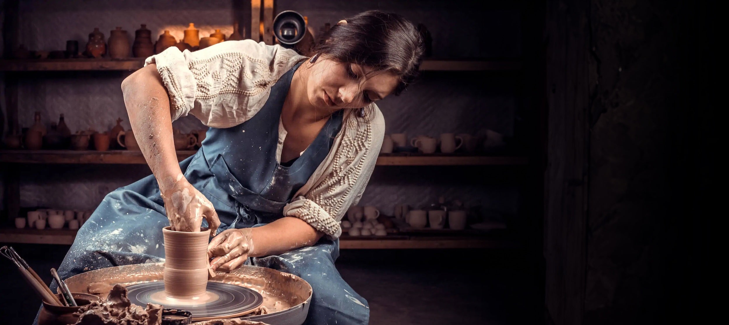 stylish-handicraftsman-posing-while-making-earthenware-concept-woman-wiiide-luxvivendi